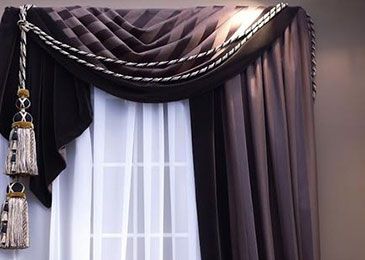 Purple drapes hanging over a window